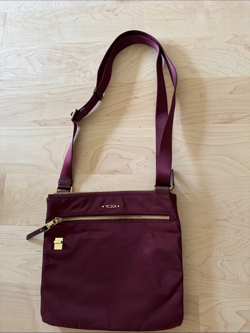Tumi burgandy nylon multi compartment crossbody bag